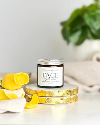 An amber glass jar with an aluminium lid.  The jar is filled with  face cream.  The label says 'Rushmere Skincare' Face serum scented with lavender and cedarwood essential oils.
